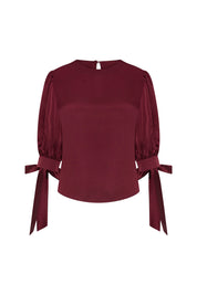 Blusa Manga Puff Moño Vino, vista frontal con lazos en los puños