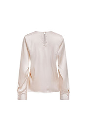 Blusa Sesgo Mancorna Cristal Beige – vista trasera con detalle de puños y mancornas