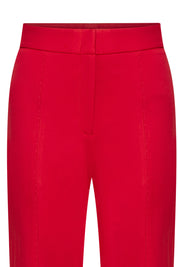 Detalle patch pantalón rojo campana - Bettina Spitz
