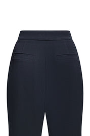 Vista trasera pantalón negro campana ribete - Bettina Spitz